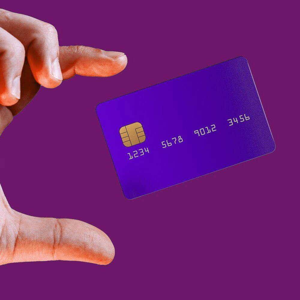 Close up male hand and levitating template mockup bank credit card
