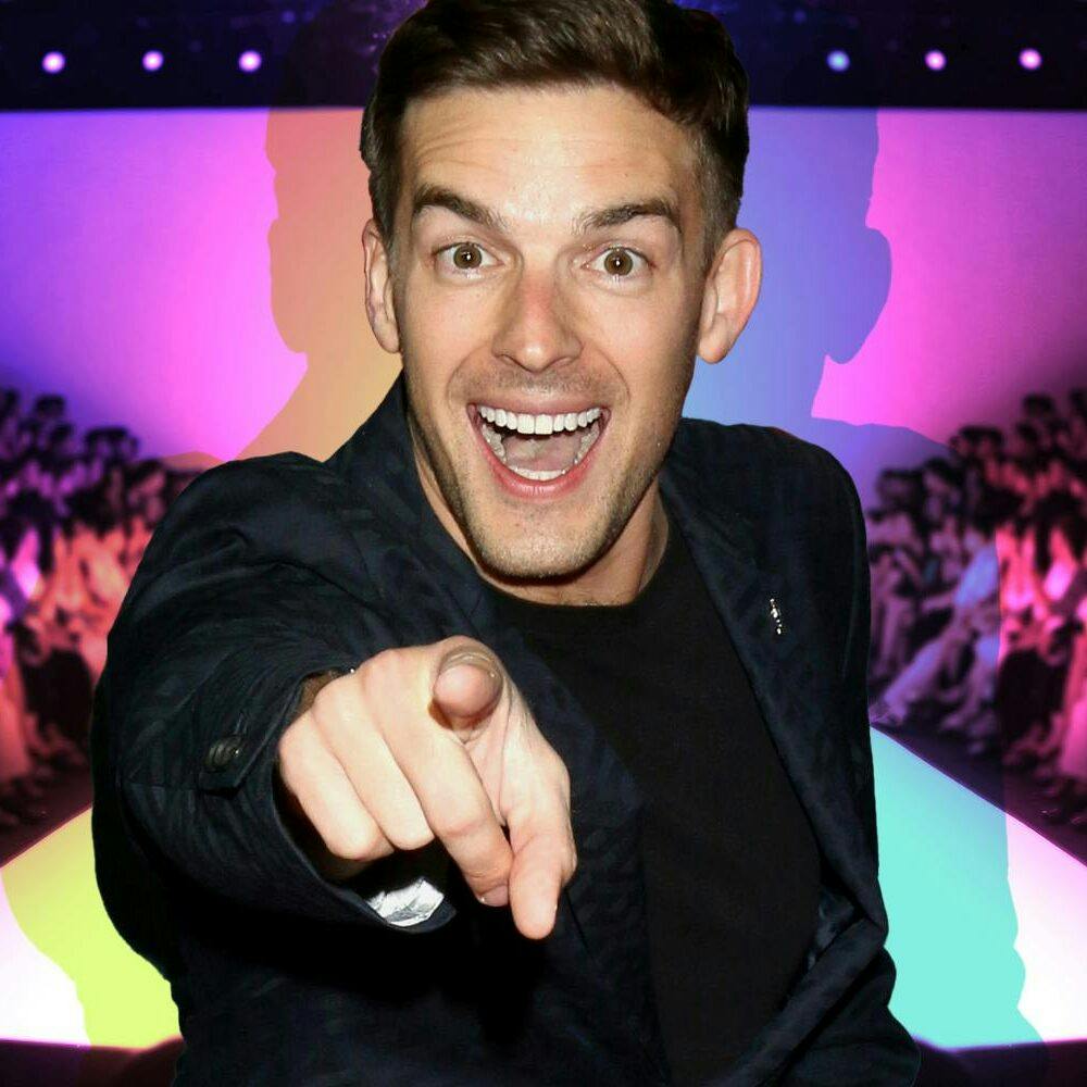 MatPat pointing and smiling, creators in fashion show background