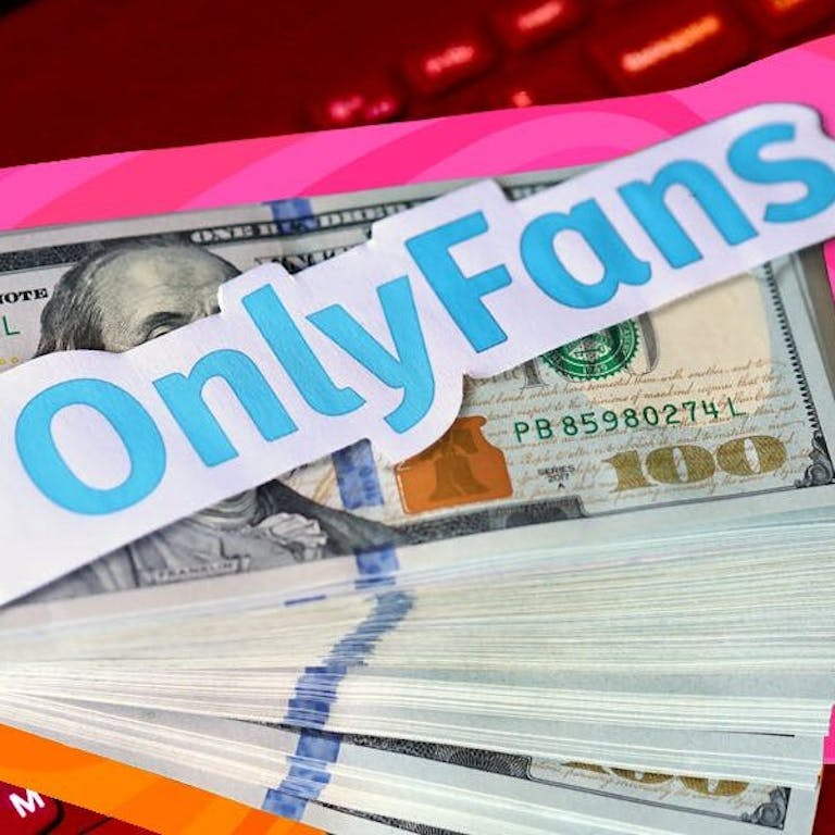 onlyfans payout - a stack of money with the onlyfans logo over it