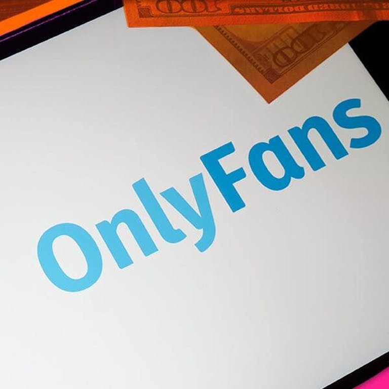 How to promote onlyfans - featured image showing someone loading onlyfans on their phone