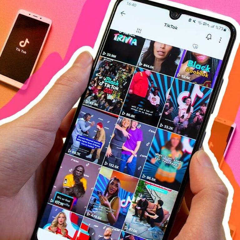 Phone with TikTok on Screen Display with pink and orange gradient background