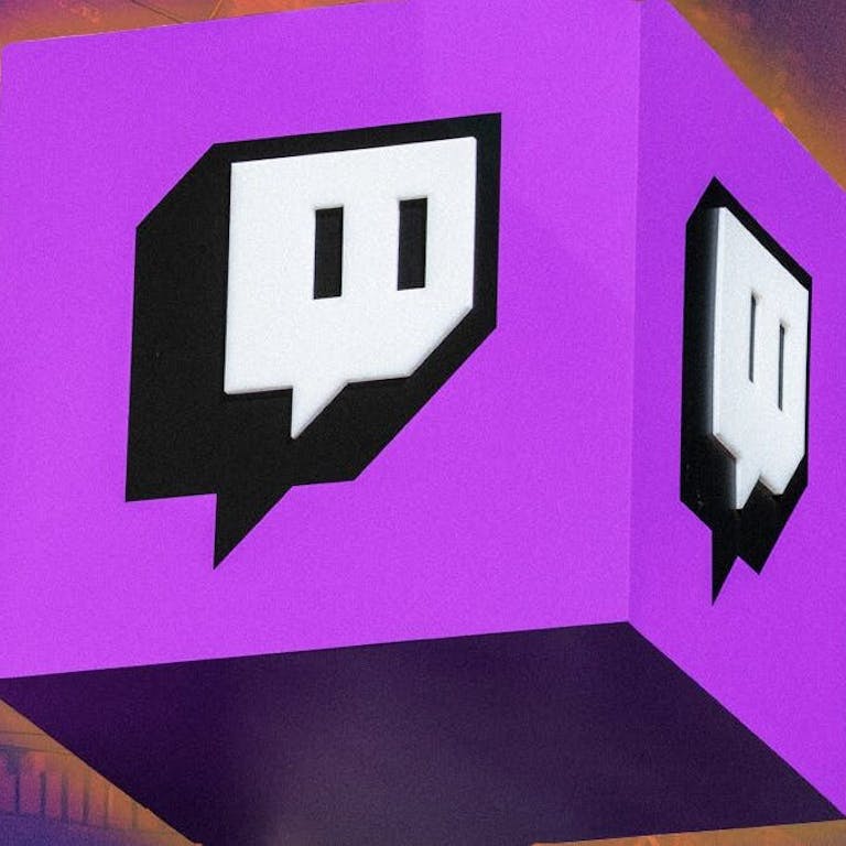 Twitch logo on cube over graphic of stocks charts