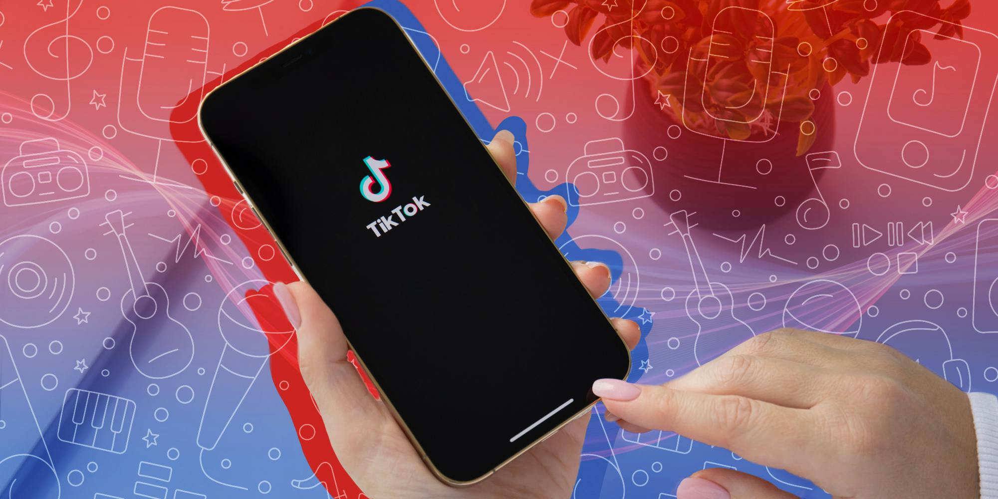 how to make a sound on tiktok - One hand holding a smartphone displaying the TikTok logo while the other hand is poised to touch the screen.