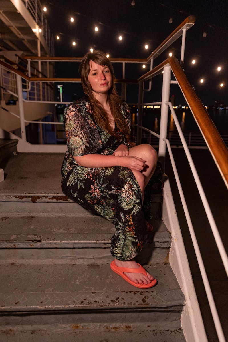 RGB Panel Pro 2.0 - A woman sitting on a boat deck at night