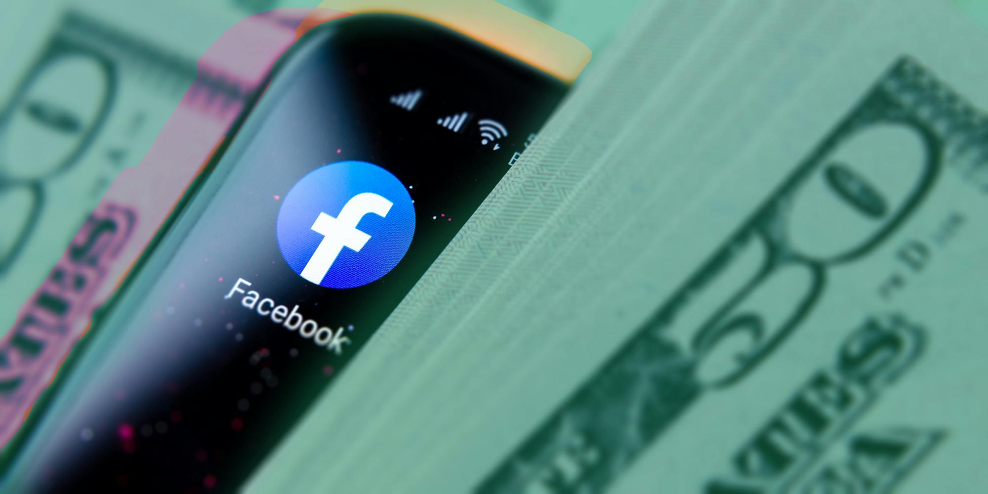 Phone with facebook app surrounded by money facebook monetization