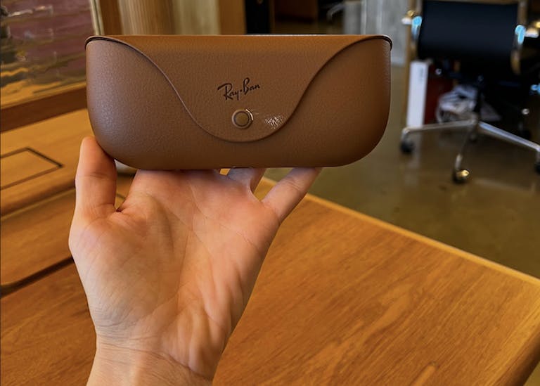 Holding up the Ray-Ban's meta smart glasses official glasses case