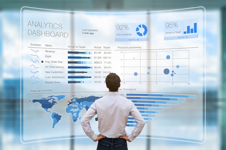 how to get brand deals - analytics matter most to brands, image of a man standing in front of a giant wall of analytics 