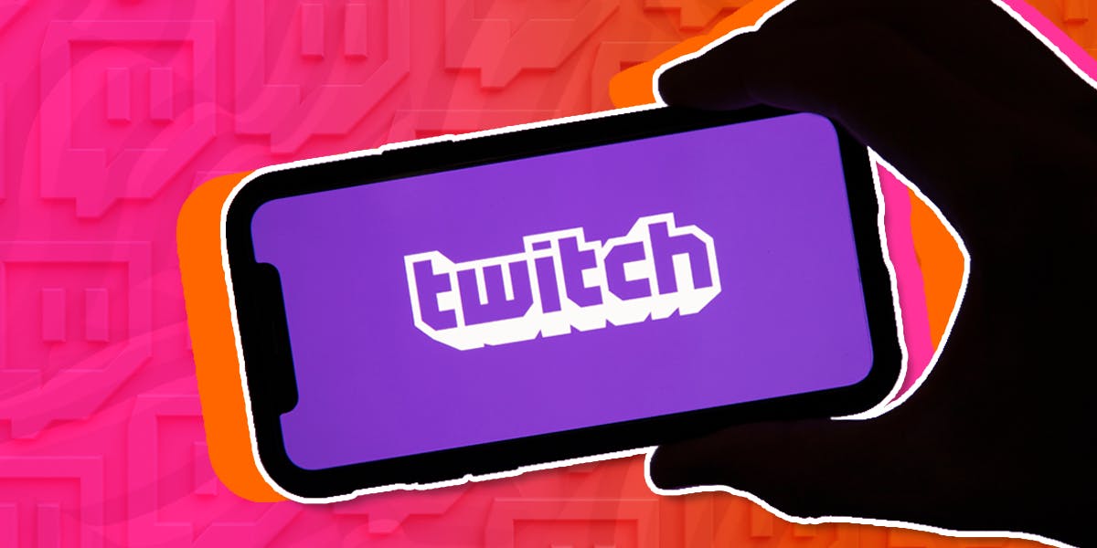 hand holding phone that says "Twitch" on the screen